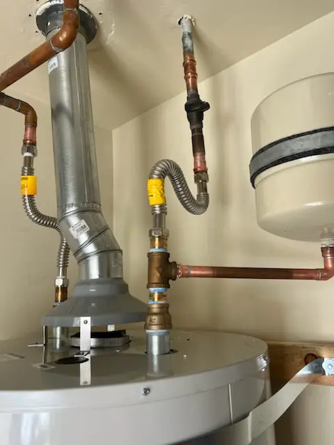 Water heater installation and plumbing repair in Pershing Place